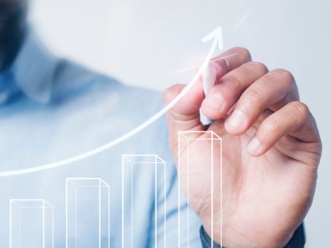 Man giving a bar graph presentation using a high technology digital pen