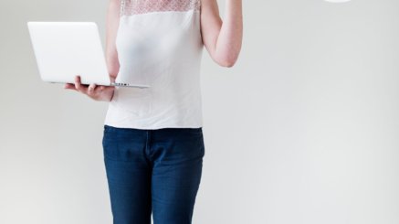 White woman using computer cloud network