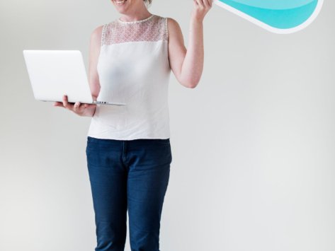 White woman using computer cloud network
