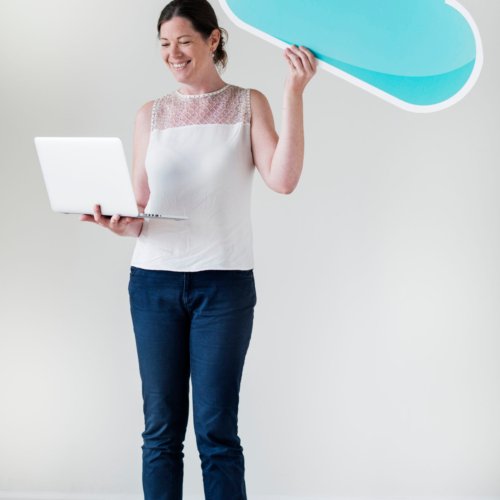 White woman using computer cloud network
